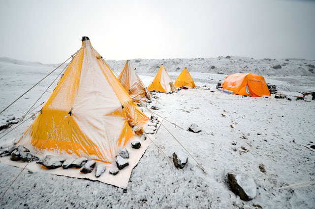 Tents covered in snow.