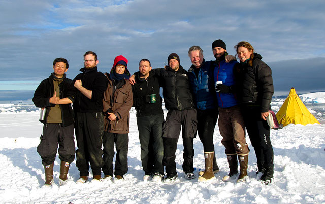 People dressed warmly in group picture.