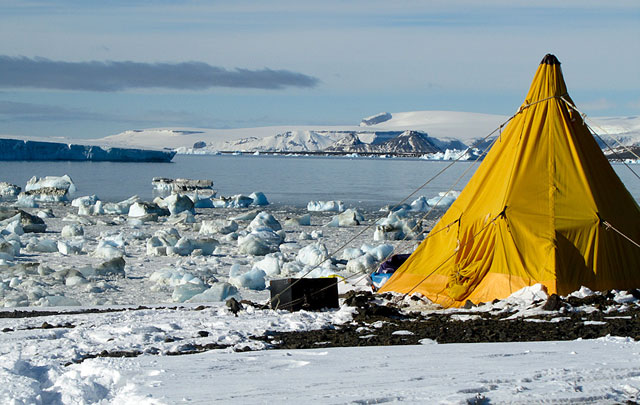 Tent pitched on snow and ice.