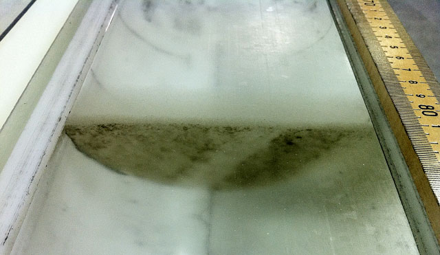 Ice core with ash layer.