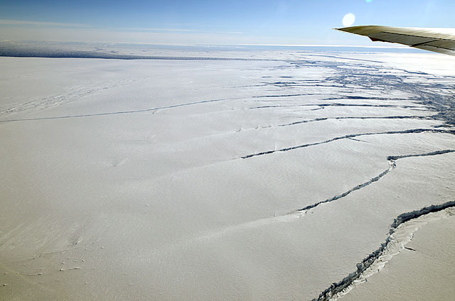 Plane tip seen over expanse of ice.