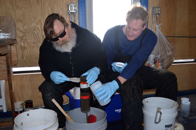 People pour muddy water into a bottle.