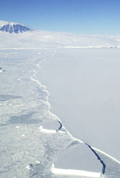 Ice edge with mountain in background.