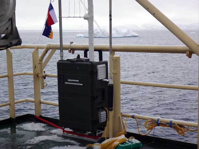 Instrument attached to ship railing.