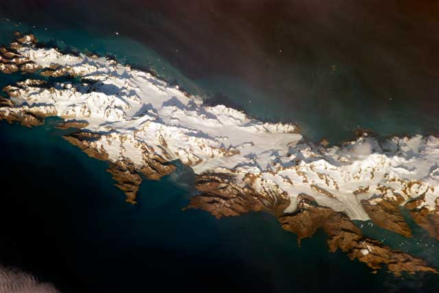 Aerial photo of snow-covered island.