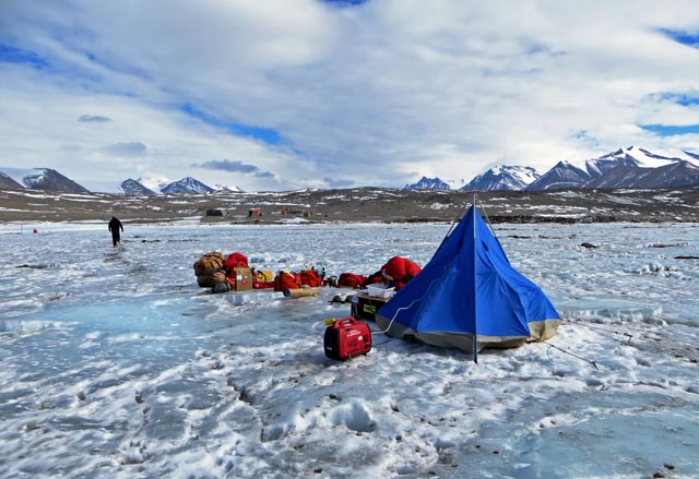 A tent sits on ice.