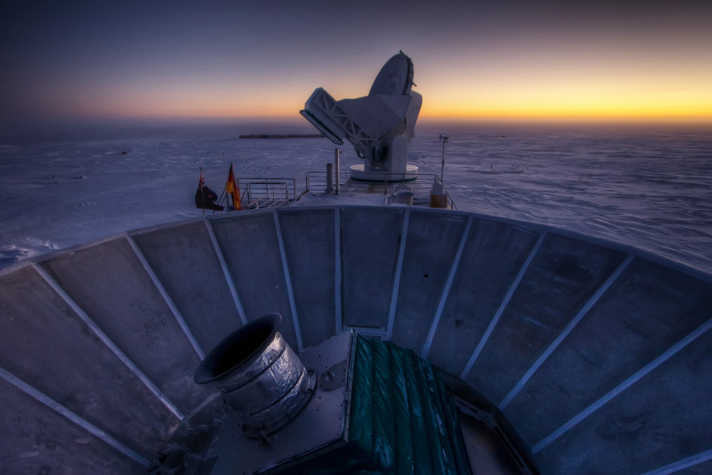Two telescopes with sunset.