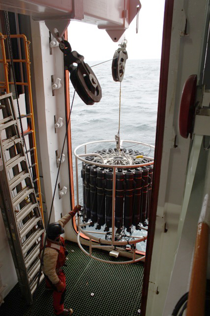 Person operates ocean instrument.