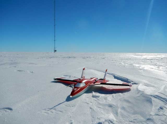 Small plane sits on ice.