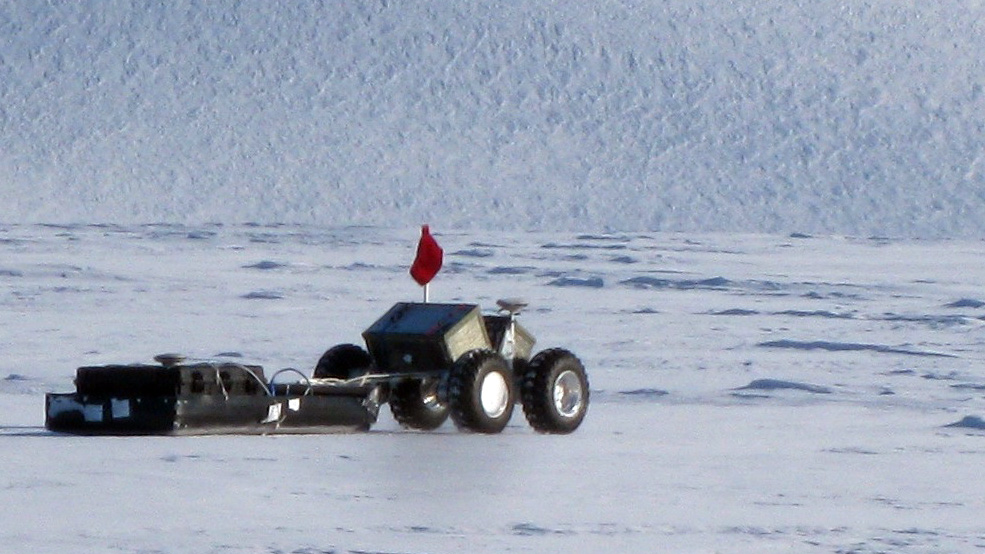 Four-wheeled vehicle drives over ice.