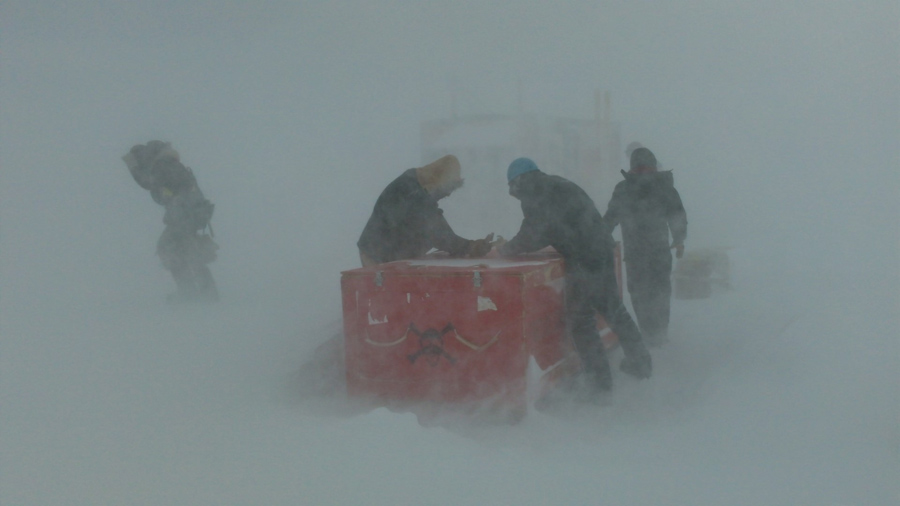 Workers out on the sea ice get hit by bad weather building a RobotHut.