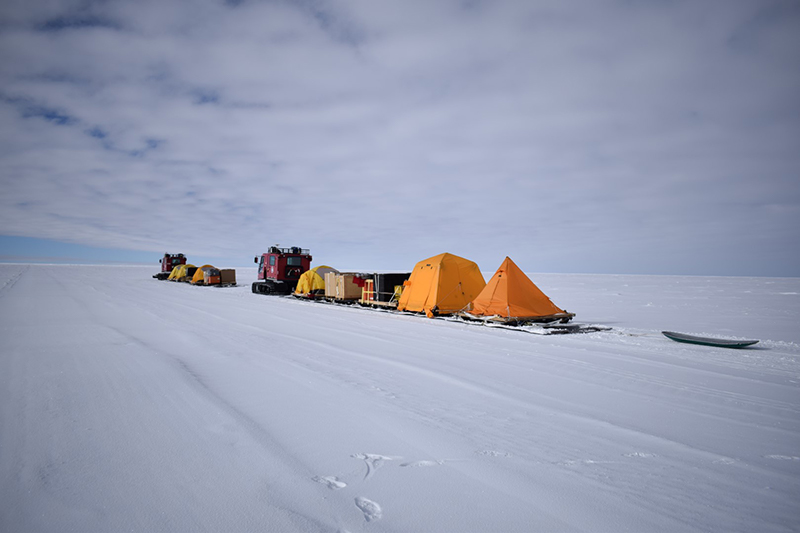 The traverse's two tracked vehicles pull sleds full of their supplies and tents towards the 88-South line of latitude
