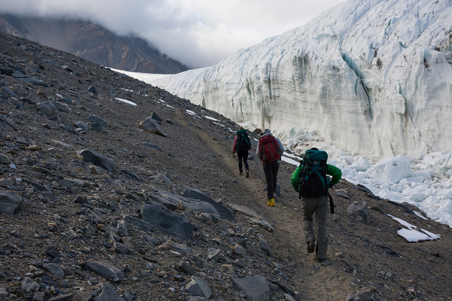 Dorota Porazinska (front) Jack Darcy (center) and Pacifica Sommers hike up to their research site on the Canada Glacier