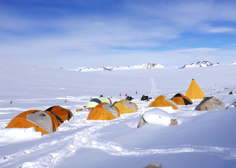 Camped atop of Deception Glacier, the team would take snowmobiles to investigate nearby rock outcroppings.