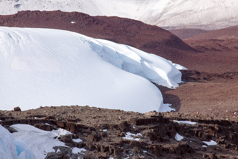 The very tip of the Shackleton glacier spills over Roberts Massif