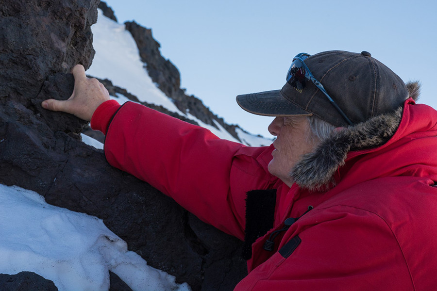 Lisa Tauxe retrieves a chunk of volcanic rock from Cape Armitage on Ross Island