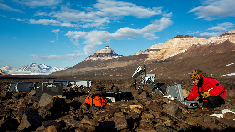 At the far end of the McMurdo Dry Valleys, Jen Lamp performs some final checks before leaving her experiment out for the austral winter.