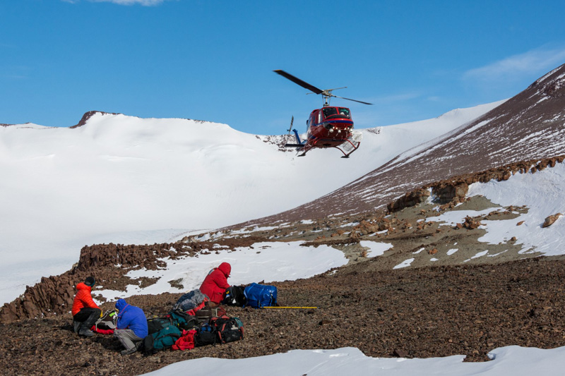 To reach the fossil-rich cliffs, the paleontology teams flew in on helicopters from the nearby Shackleton Glacier field camp
