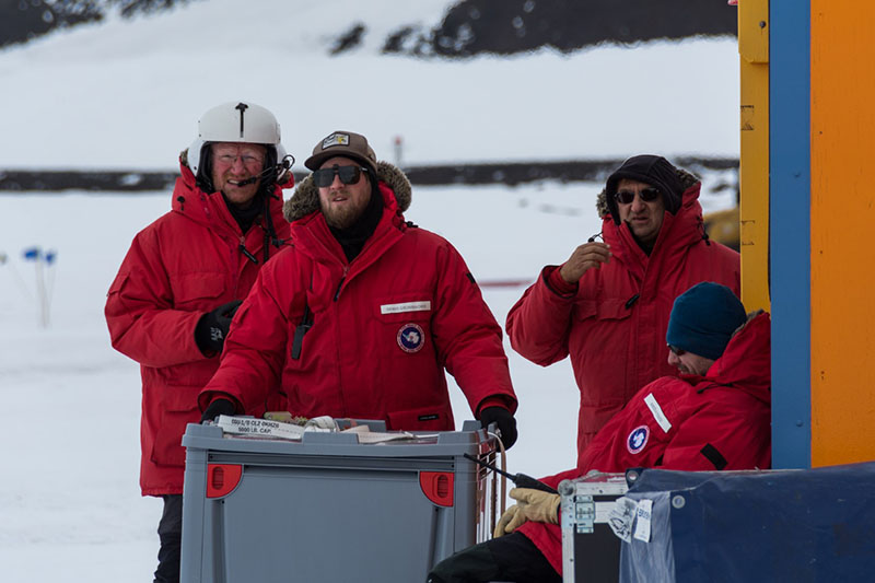 (Left to right) Lars Jensen, Denys Grombacher, Slawek Tulaczyk and Nikolaj Foged monitor the liftoff of SkyTEM from their fish hut near McMurdo Station