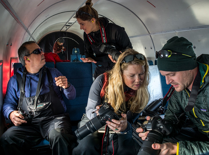 (Left to right) Leo Salas, Sara Labrousse, Michelle LaRue and David Iles prepare their cameras as they near an emperor penguin colony.