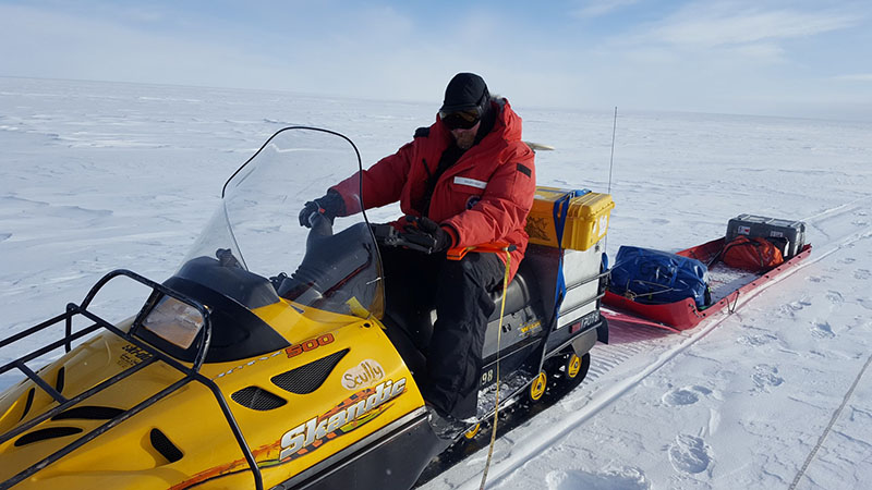 Seismologist Galen Kaip with the TIME research team, prepares to ride out to their testing area with his seismic equipment in tow.