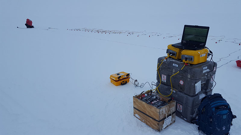 Seismologist Galen Kaip lays a line of seismometers to listen to the echoes of their explosive charge.