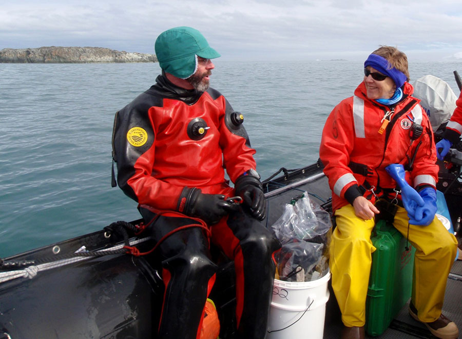 Chuck Amsler (left) talks with Maggie Amsler as he prepares to scuba dive to collect amphipods near Palmer Station.