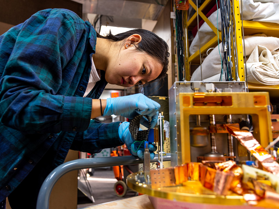 Cyndia Yu works on disassembling one of the receivers of the Keck Array. 