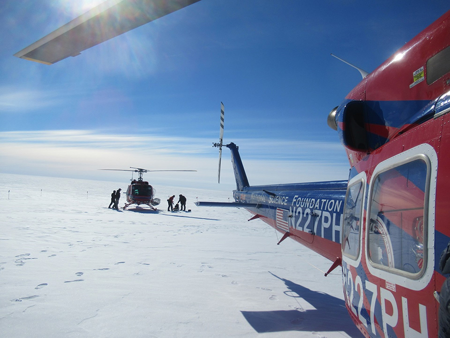 Two helicopters drop off recovery team members at the payload landing site. 