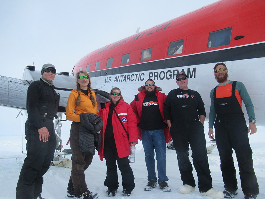 The recovery team pose next to a Basler at the landing strip. Left to right: Scott Battaion, Kaija Webster, Lindsey Lisalda, Richard Bose, Brian Rauch and Andrew West. 