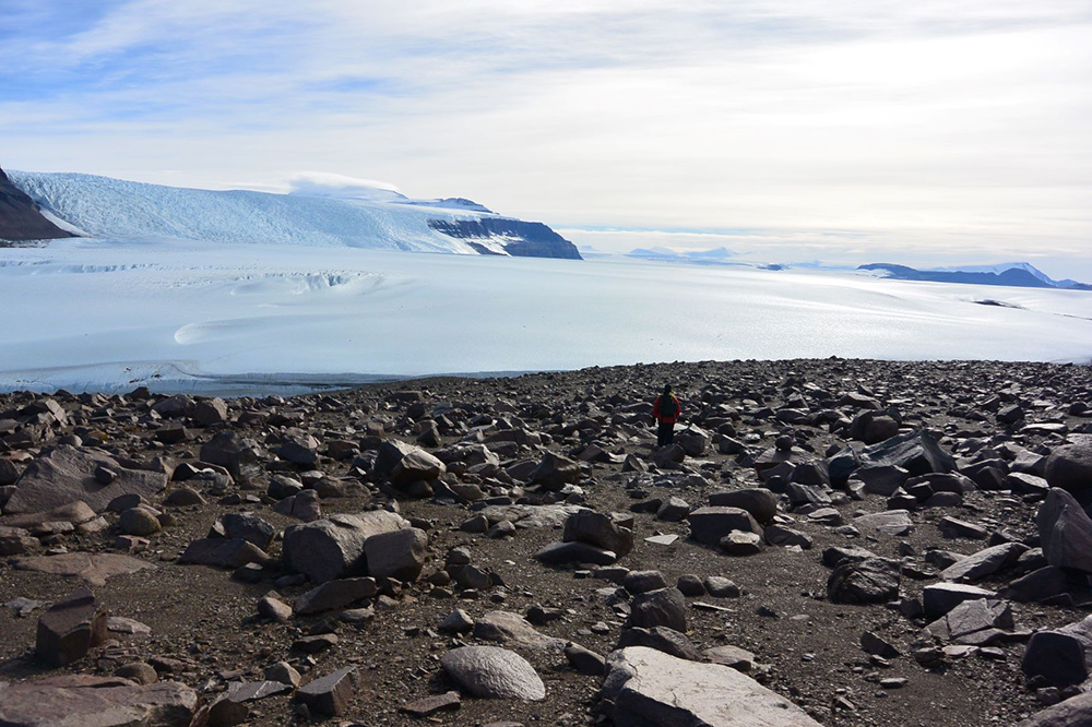 Marci Shaver-Adams of Brigham Young University heading out to sample soils near the edge of the Shackleton Glacier.