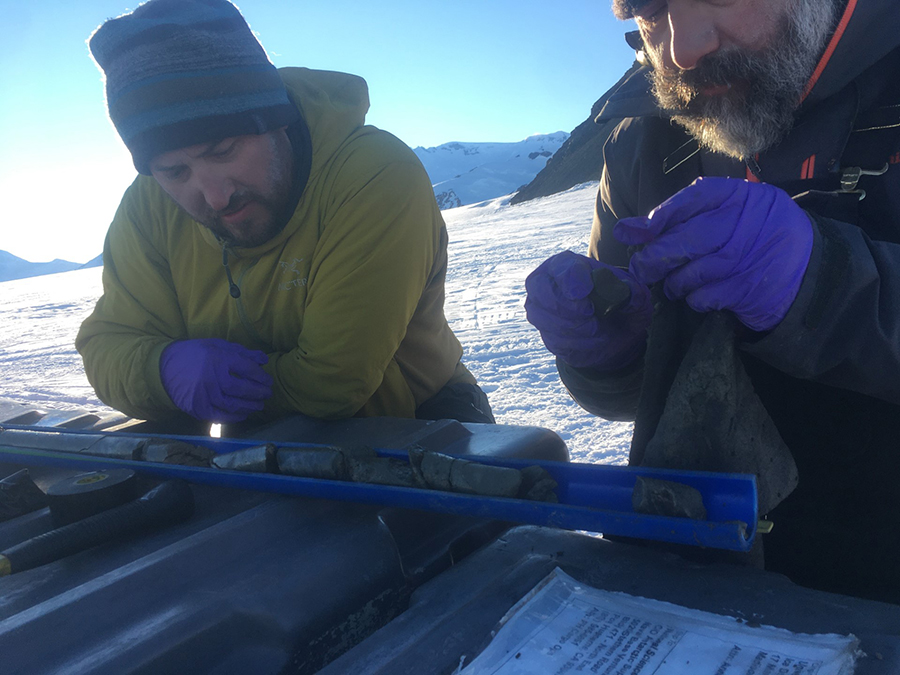 Brent Goehring (left) and Greg Balco analyze rock cores collected from the top layers of the bedrock beneath the glacier.