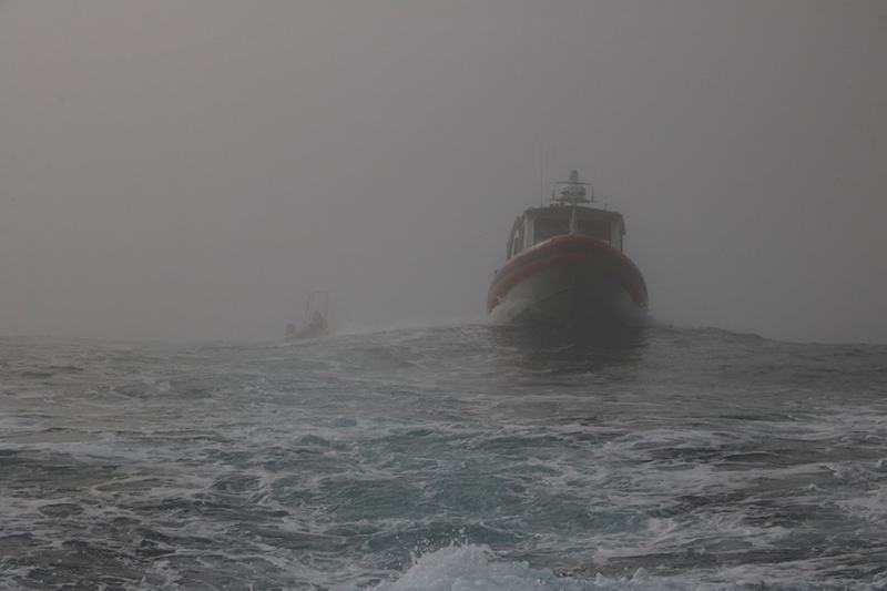 The seabird researchers attempt to reach the Rosenthal Islands through the fog on board the RHIB Rigil