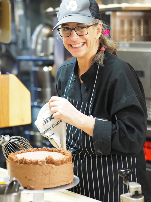 Chef Lisa Minelli-Endlich prepares a cake for the Midwinter celebration