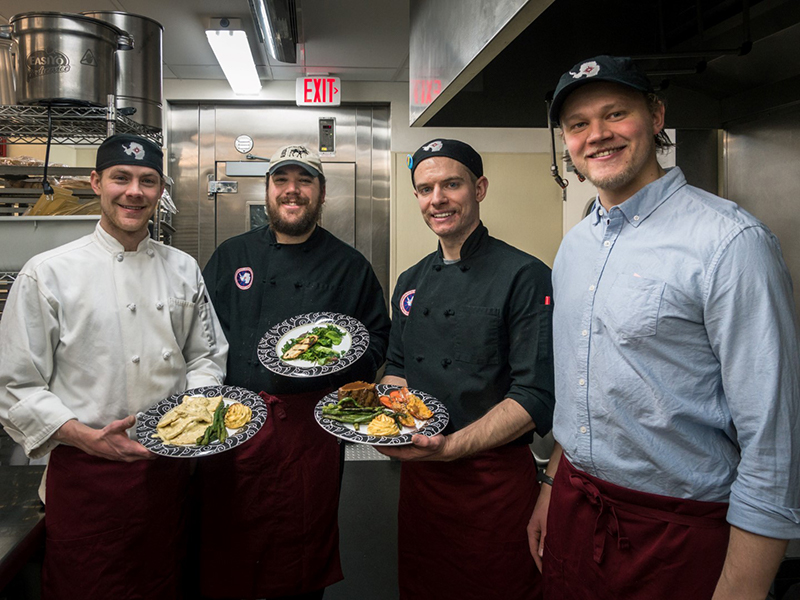 Cooks and dining attendants serve up the annual Midwinter feast