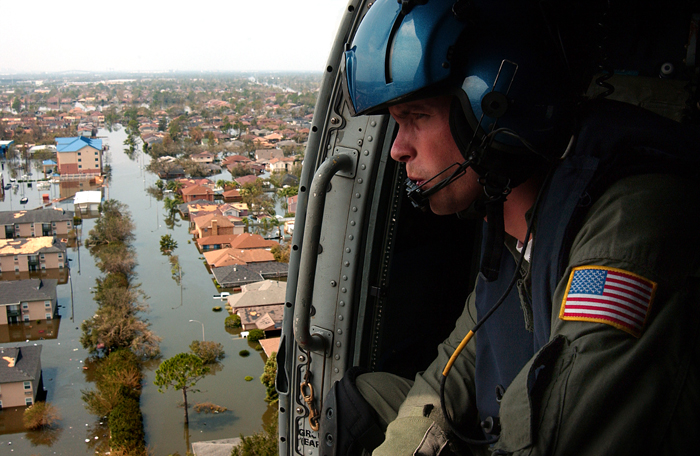Helicopter flies over Hurricane Katrina devastation.