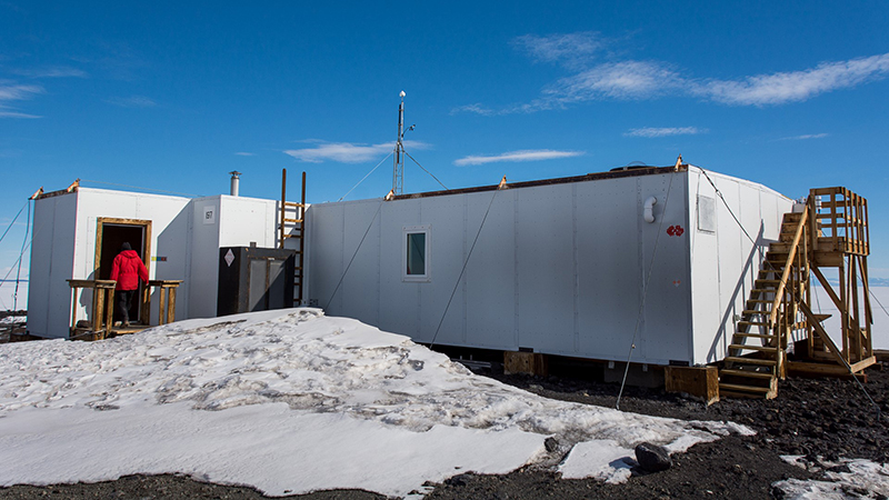 Research Associate Graham Tilbury enters the Arrival Heights lab uphill from McMurdo Station, home to a wide range of instruments and sensors that need a quiet spot to operate.