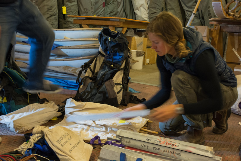Anna Zajicek inspects equipment being returned by a research team coming back from the field