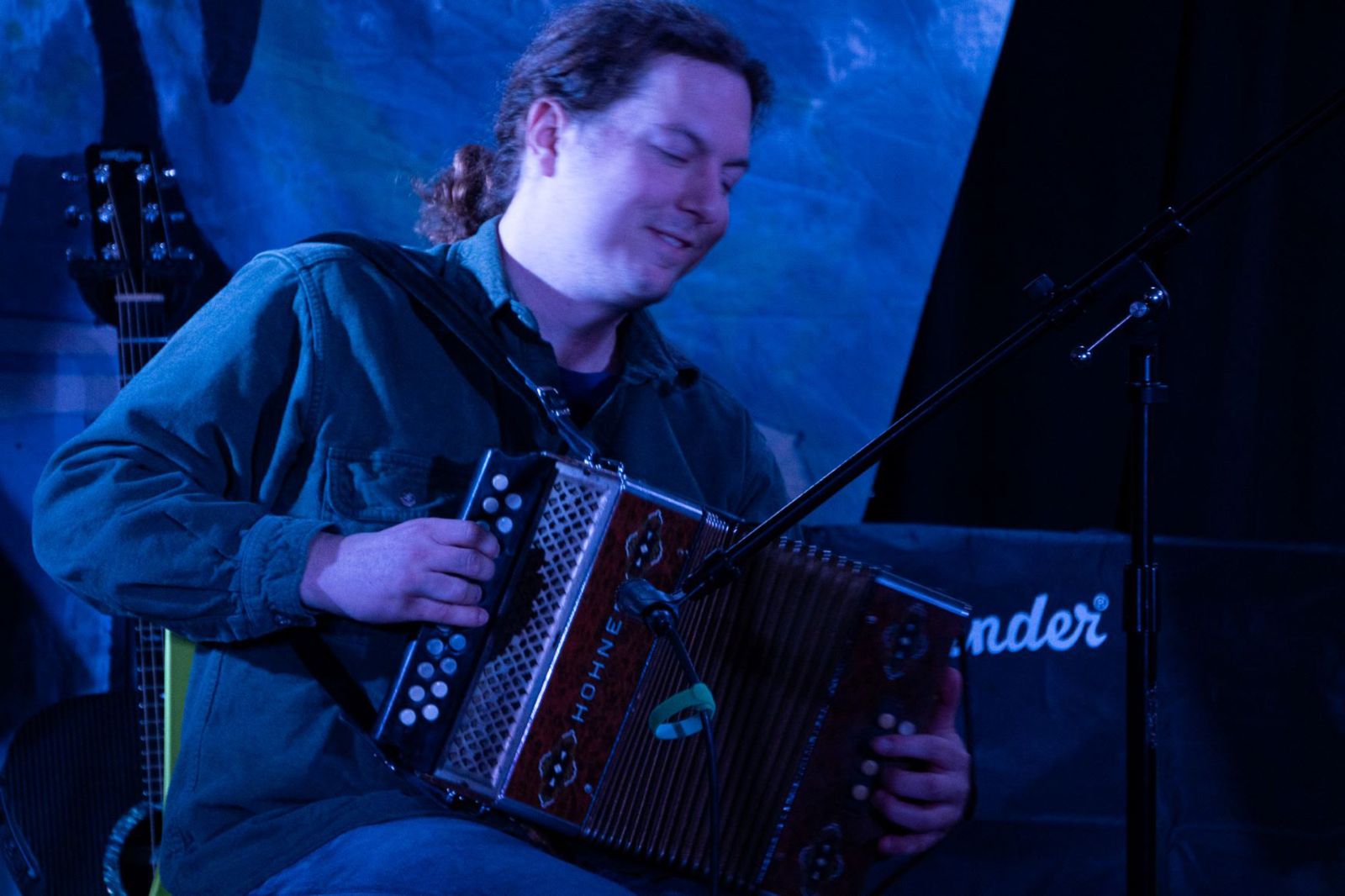 Eric Schweizer entertains the McMurdo Open Mic audience on the English melodeon.