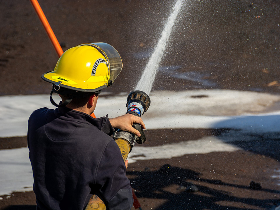 Firefighter Mike Meriwether shoots a stream of water during a hose test, an annual check to make sure all of the station’s equipment is in good working order. 
