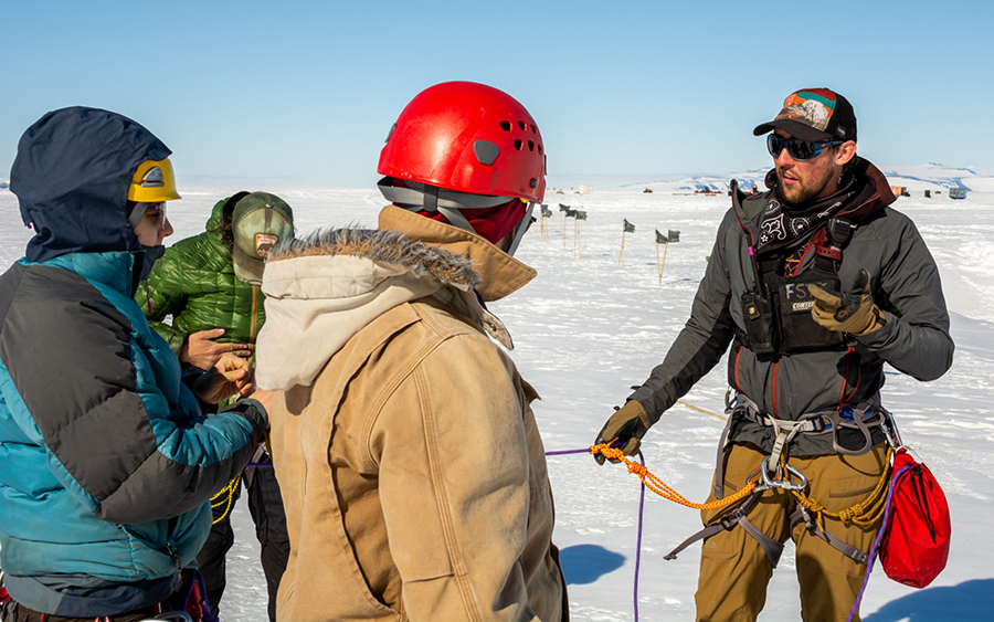 Out at McMurdo Station's crevasse simulator, Mitch Beres teaches (left to right) Christina Bovinette, Federico Piola and Peter Pankowsky proper techniques for rappelling down an ice cliff. 