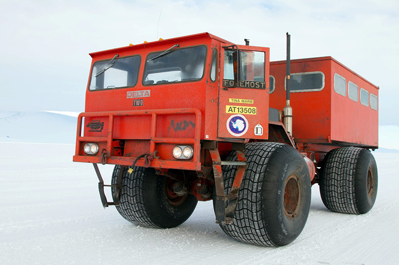 The bright orange Deltas can carry about a dozen people. With their wide tires, they can make it through all but the toughest snow conditions.