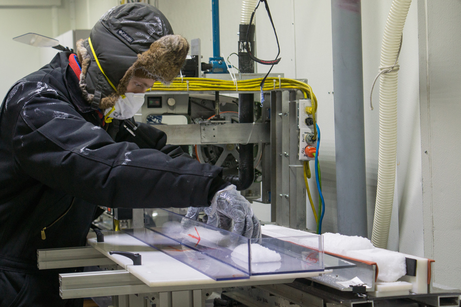 Richard Nunn, the assistant curator at the National Ice Core Laboratory, slices up recently acquired ice core samples.